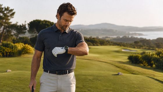 Golfer checking distances on a GPS watch